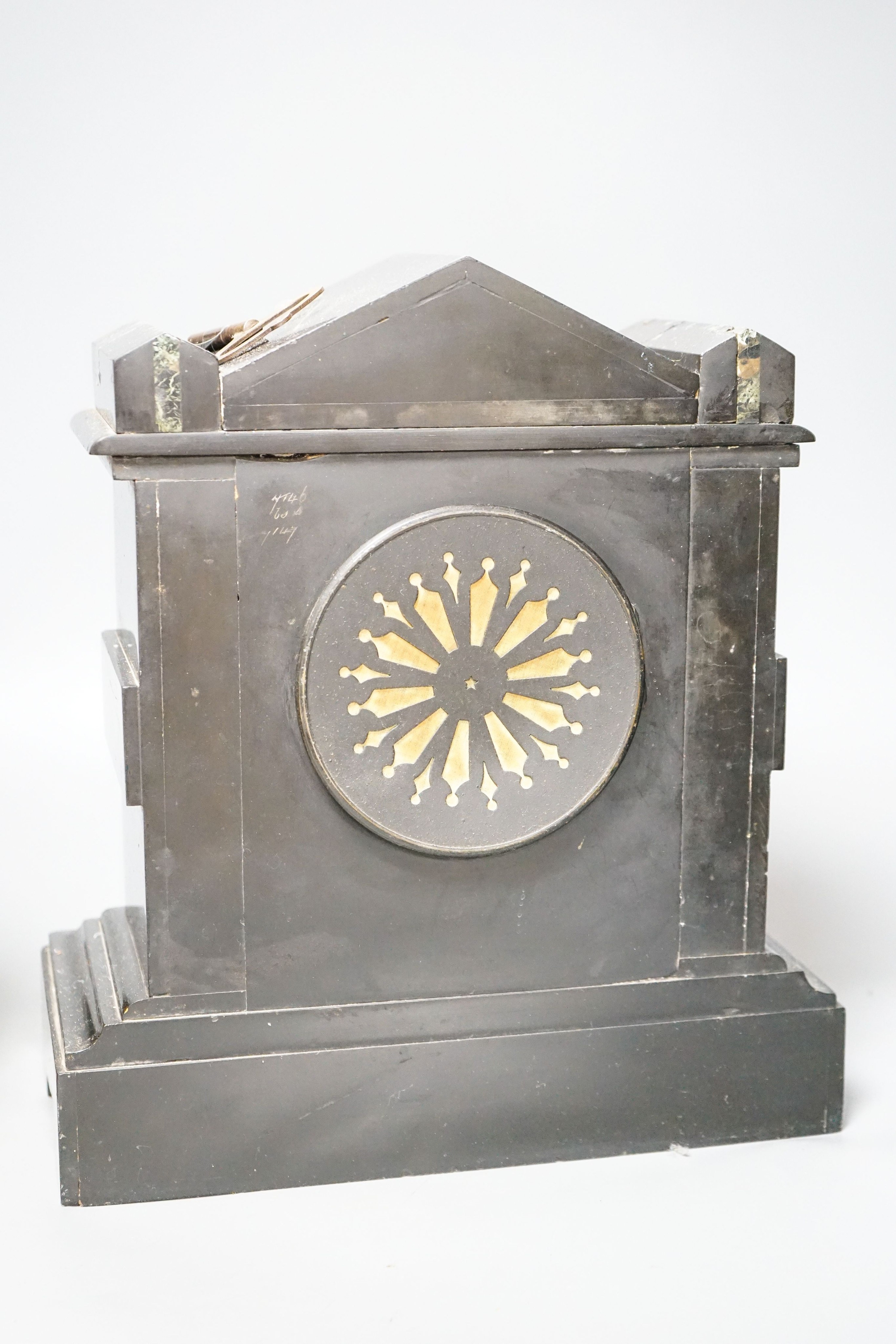 A Victorian slate clock and a 1930's arched clock